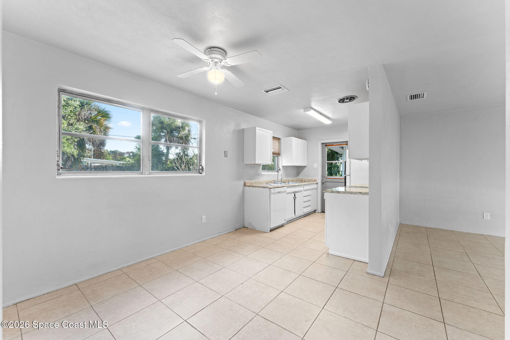 1042 Azalea Lane Cocoa, FL 32922 - Photo 8 of 26 a view of kitchen with furniture and window