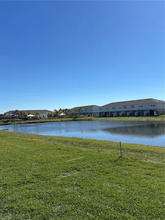 a view of a swimming pool with a table and chairs