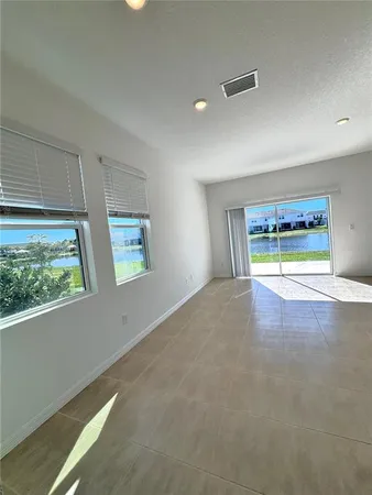 a view of an empty room with a window