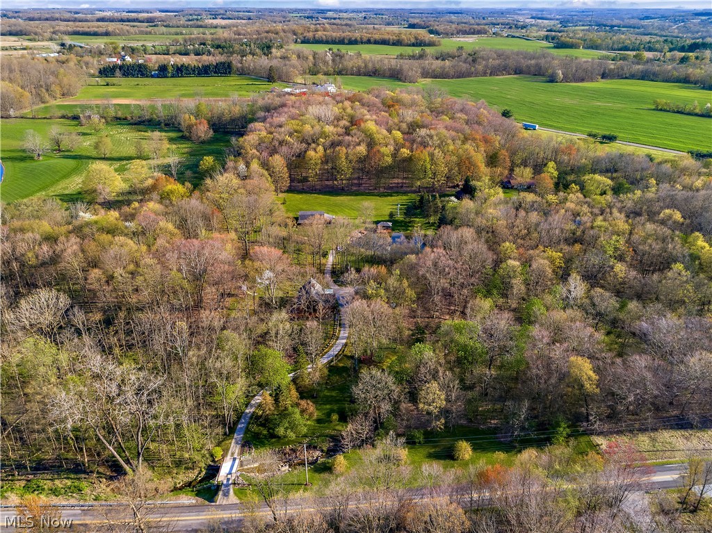 Gorgeous five acre property with wonderful A-frame house, woods, pasture, gardens, barn, workshop, and pond.