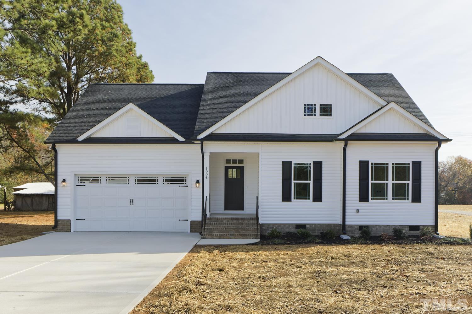 1004 Butler Drive Erwin, NC 28339 - Photo 1 of 38 a view of a house with wooden fence