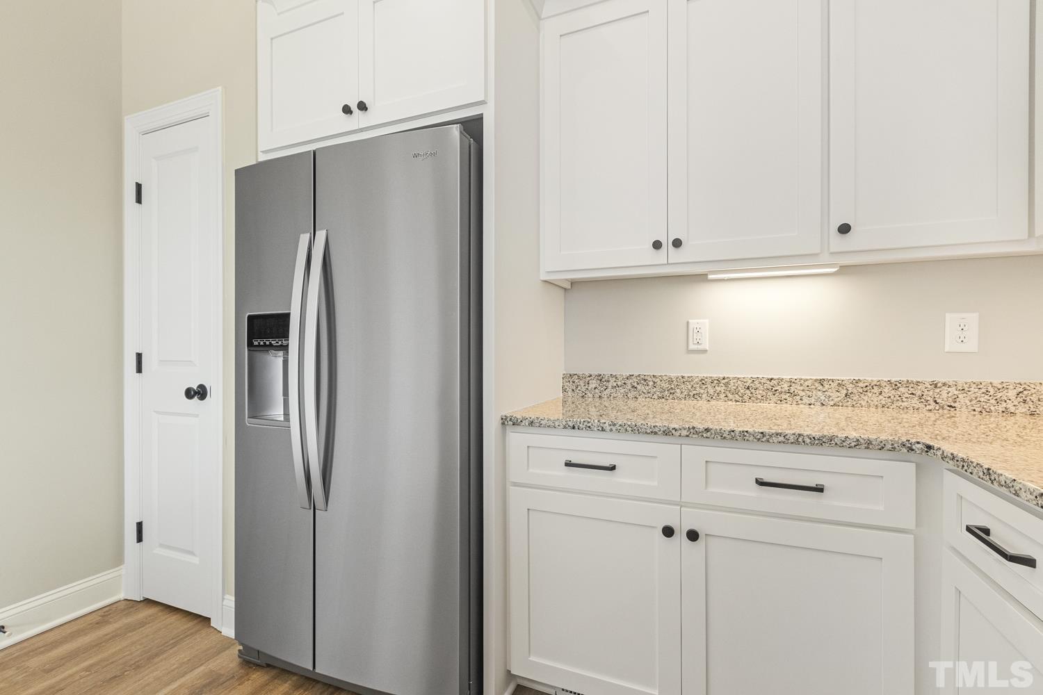 1004 Butler Drive Erwin, NC 28339 - Photo 19 of 38 a kitchen with stainless steel appliances granite countertop a refrigerator and white cabinets