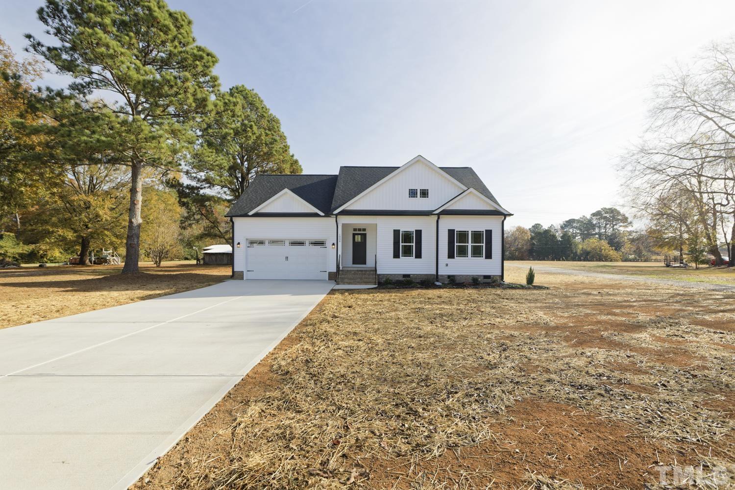 1004 Butler Drive Erwin, NC 28339 - Photo 2 of 38 a front view of a house with a yard