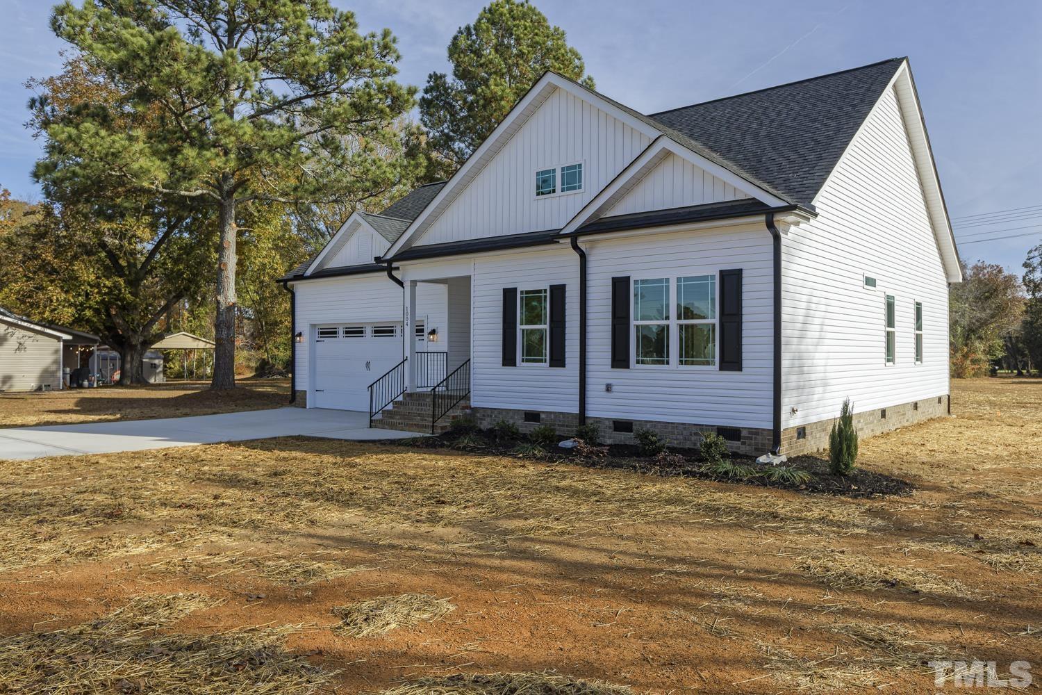 1004 Butler Drive Erwin, NC 28339 - Photo 6 of 38 a view of a house with a yard