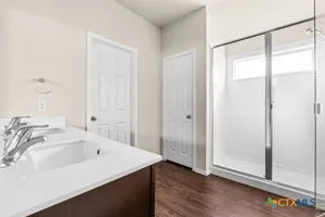 a bathroom with a bathtub and a sink