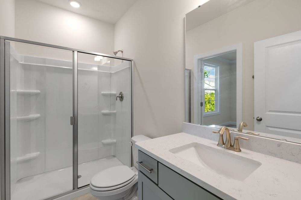5129 Lizard Tail Lane Raleigh, NC 27603 - Photo 19 of 49 a bathroom with a sink toilet and shower