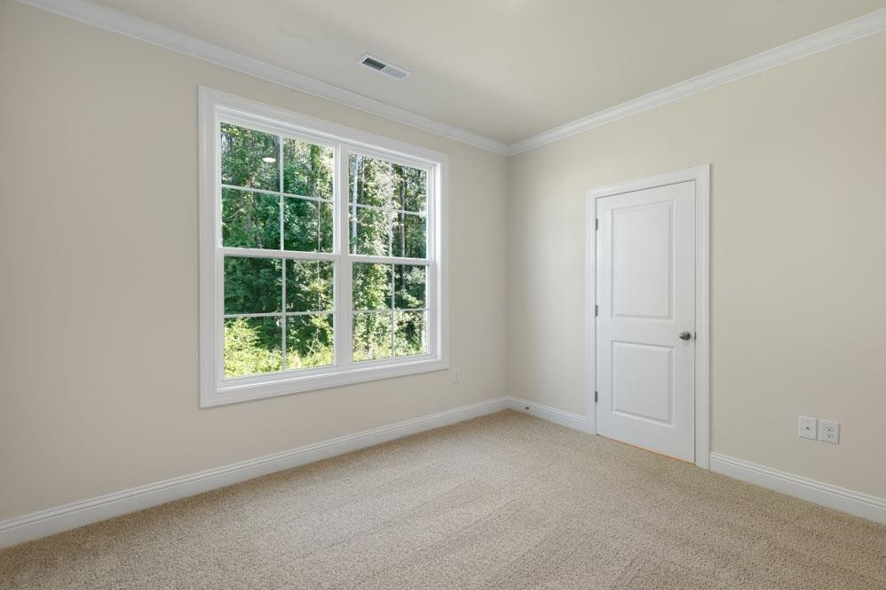 5129 Lizard Tail Lane Raleigh, NC 27603 - Photo 24 of 49 an empty room with a window