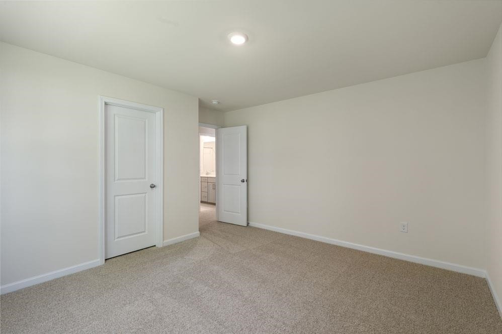5129 Lizard Tail Lane Raleigh, NC 27603 - Photo 25 of 49 an empty room with closet area