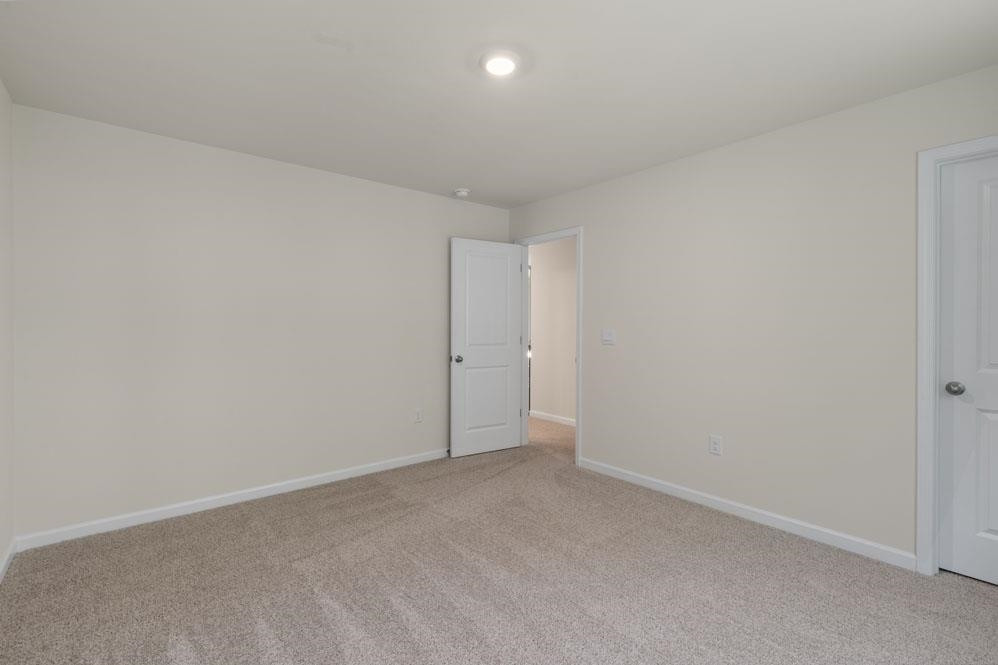 5129 Lizard Tail Lane Raleigh, NC 27603 - Photo 27 of 49 a view of an empty room