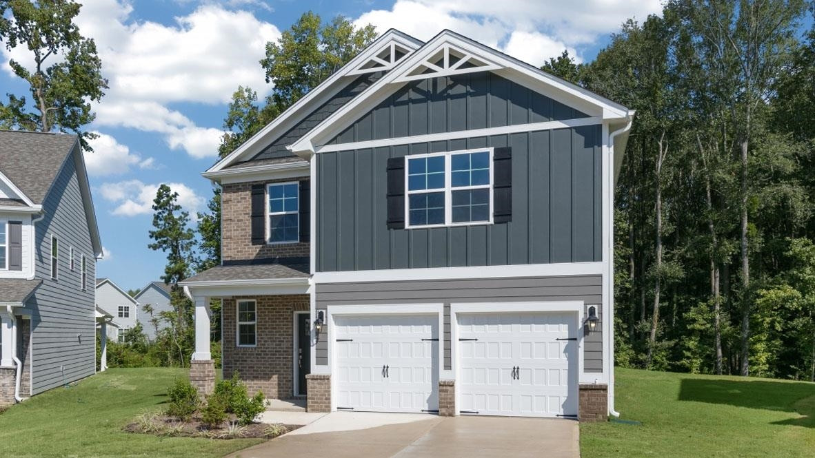 5129 Lizard Tail Lane Raleigh, NC 27603 - Photo 3 of 49 a front view of a house with a yard