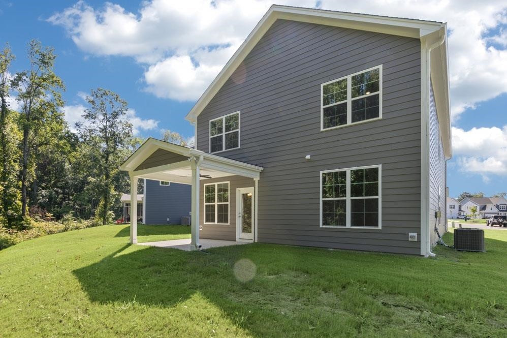 5129 Lizard Tail Lane Raleigh, NC 27603 - Photo 4 of 49 a view of a house with a yard