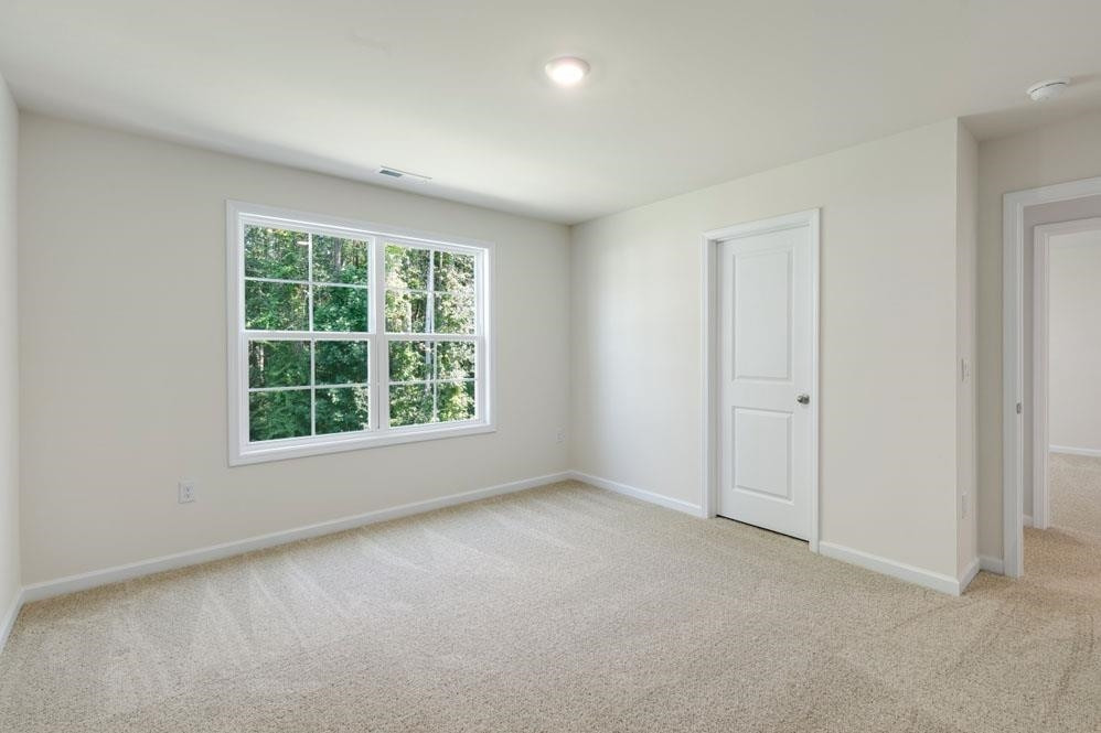 5129 Lizard Tail Lane Raleigh, NC 27603 - Photo 42 of 49 an empty room with a window