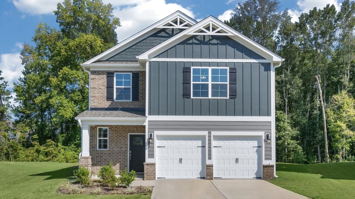 5129 Lizard Tail Lane Raleigh, NC 27603 - Photo 5 of 49 a front view of a house with a yard