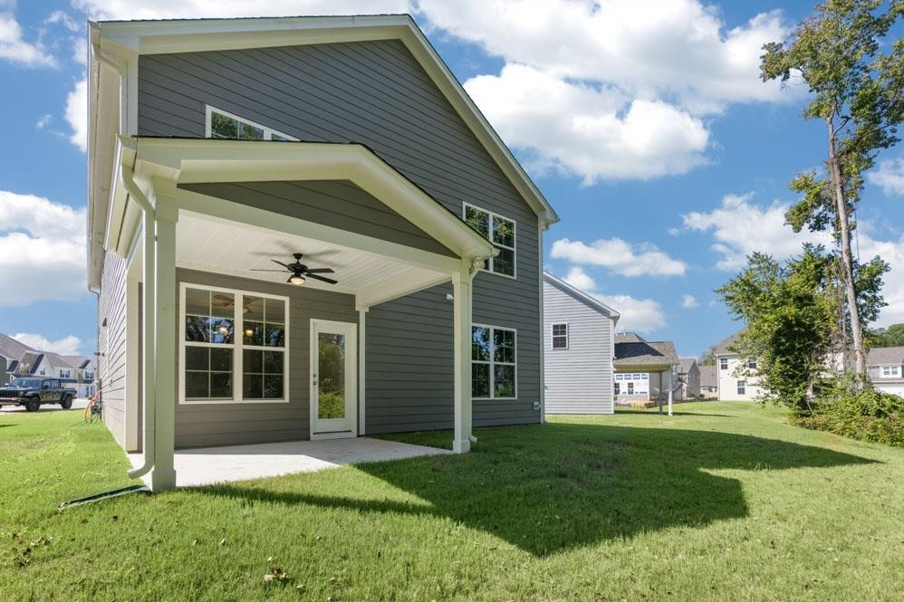 5129 Lizard Tail Lane Raleigh, NC 27603 - Photo 6 of 49 a view of an house with backyard space and garden