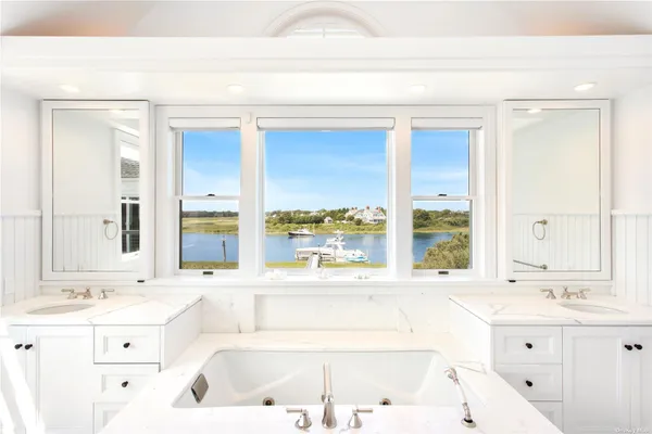 a bathroom with a bathtub and a sink