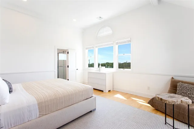 a bathroom with a toilet sink shower and mirror
