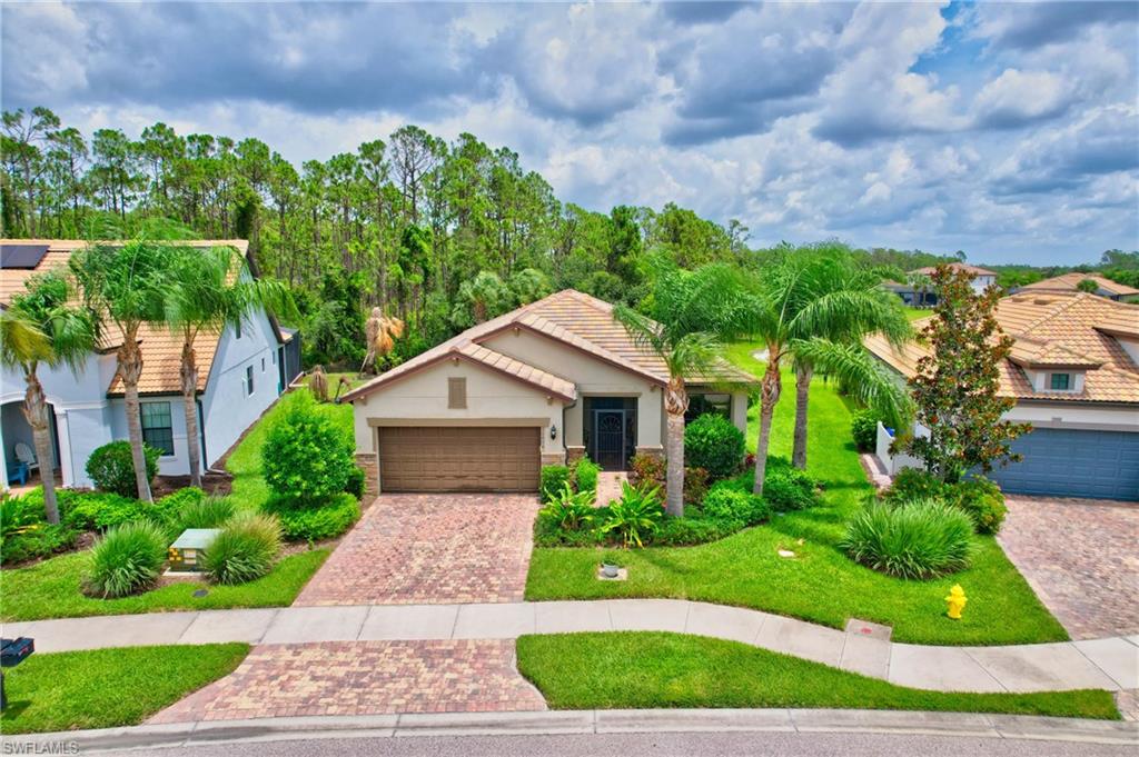Front of Home Pavered Driveway Tandem Garage- 3 car