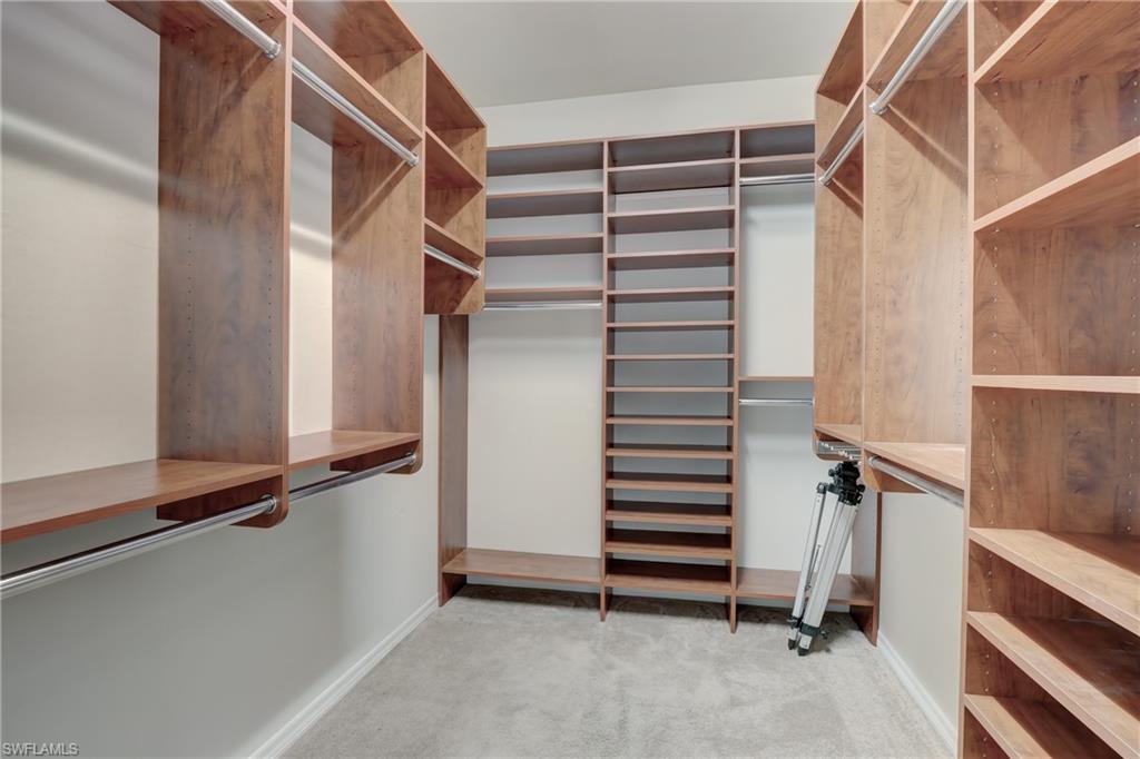 10894 Dennington Road Fort Myers, FL 33913 - Photo 32 of 49 Master Closet with Built In Shelving & Rods