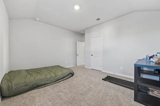 a living room with a bed and furniture
