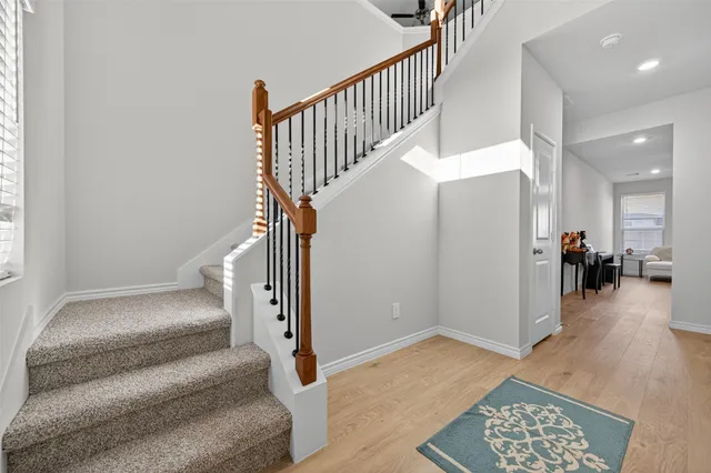 a view of entryway and hall with a rug