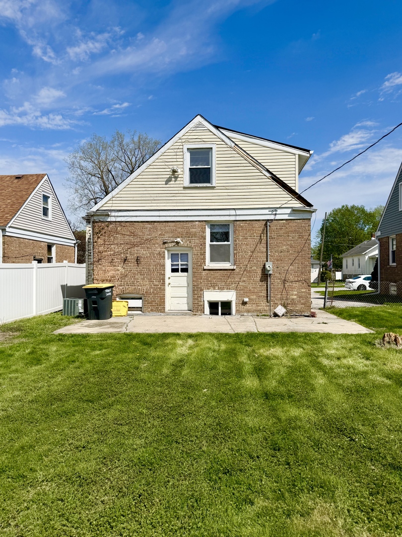 17826 School Street Lansing, IL 60438 - Photo 2 of 23 a front view of a house with a yard