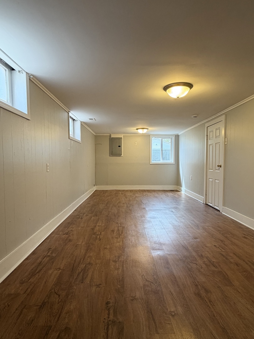 17826 School Street Lansing, IL 60438 - Photo 21 of 23 a view of empty room with wooden floor and fan