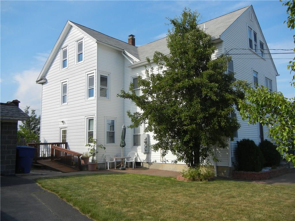 42 Anderson Avenue Waterbury, CT 06708 - Photo 1 of 1 a view of a white house next to a yard with big trees
