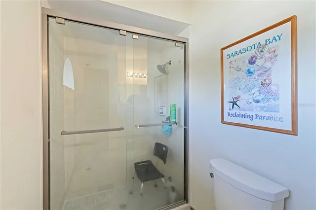 a bathroom with a shower and a toilet