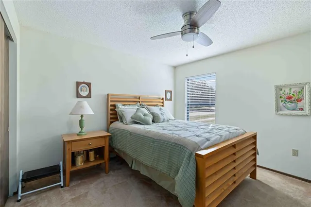 a bedroom with a bed and a table