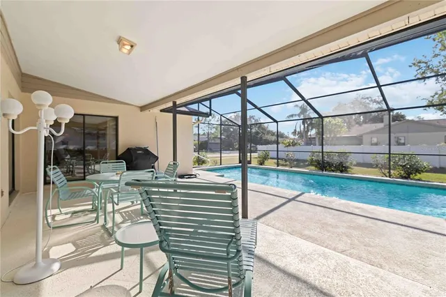 a view of a living room and floor to ceiling window or kitchen