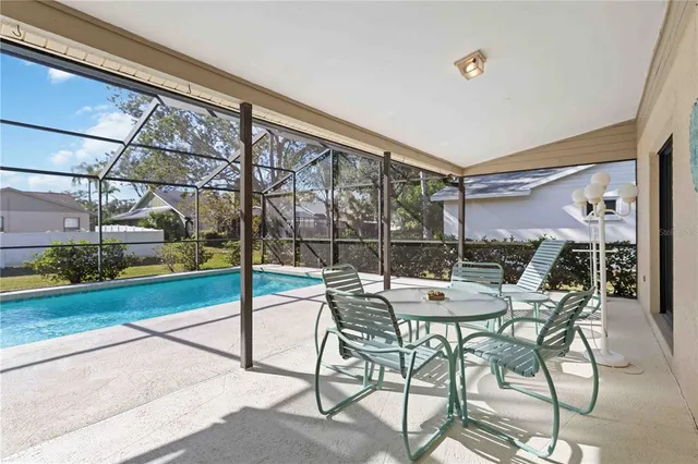 a view of a patio with a table and chairs