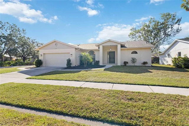 a view of an house with swimming pool and yard
