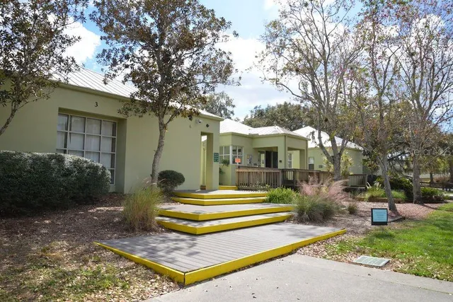 a view of street with wooden fence