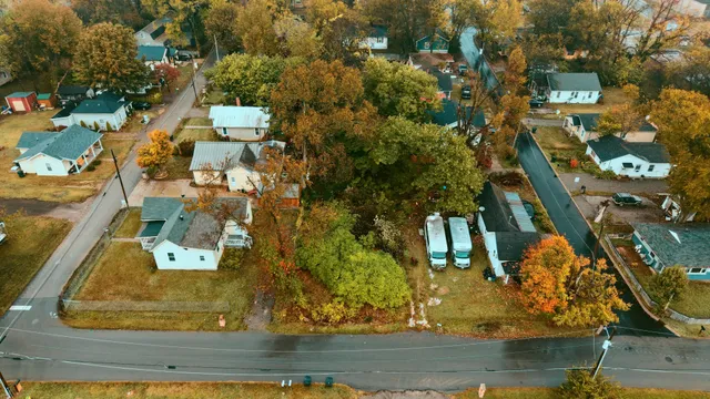 an aerial view of residential houses with outdoor space