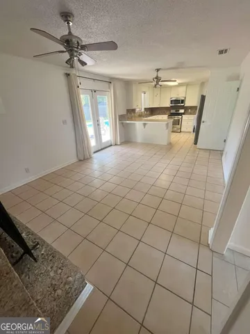 a view of a kitchen with furniture and a fireplace