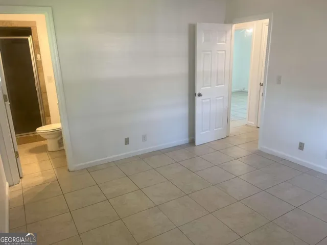 an empty room with mirror