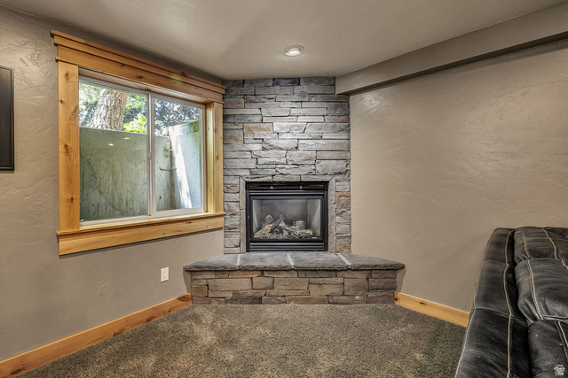 288 525 South Providence, UT 84332 - Photo 30 of 71 Corner fireplace featuring a stacked stone surround and hearth