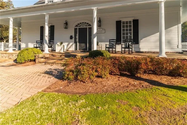 an aerial view of a house with a lake view