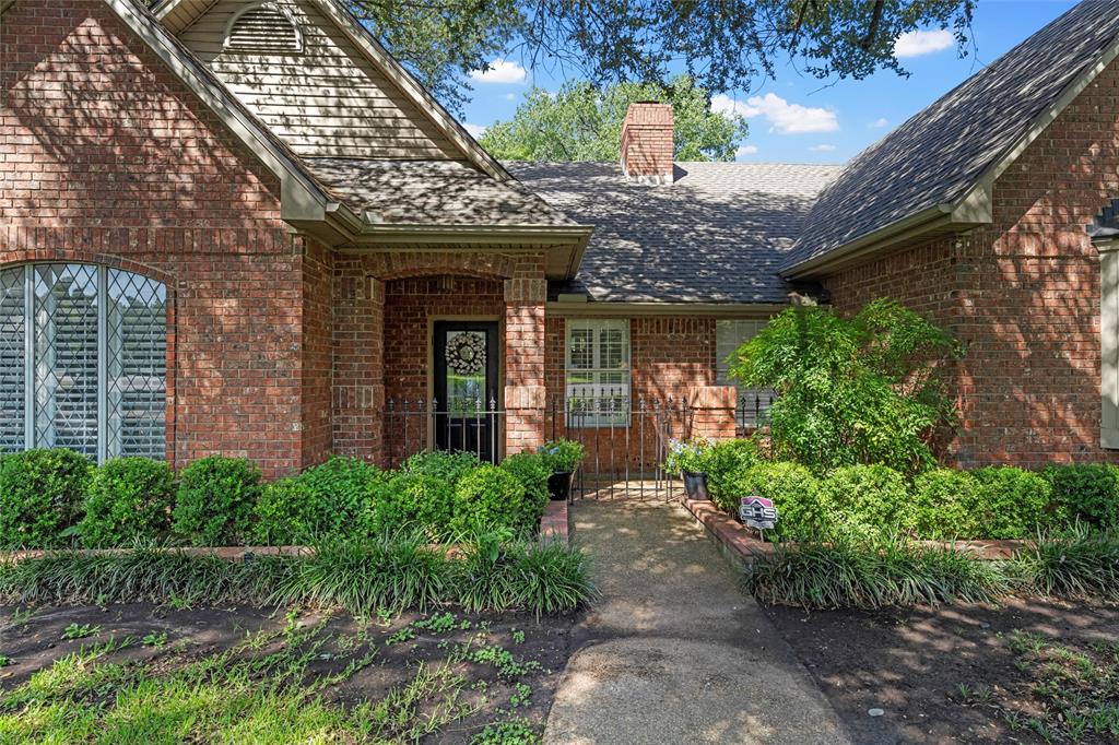 3000 Chimney Hill Drive Waco, TX 76708 - Photo 4 of 37 a front view of a house with garden