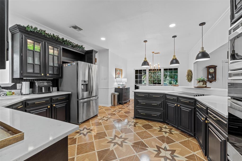 3000 Chimney Hill Drive Waco, TX 76708 - Photo 9 of 37 a kitchen with stainless steel appliances a stove sink and cabinets