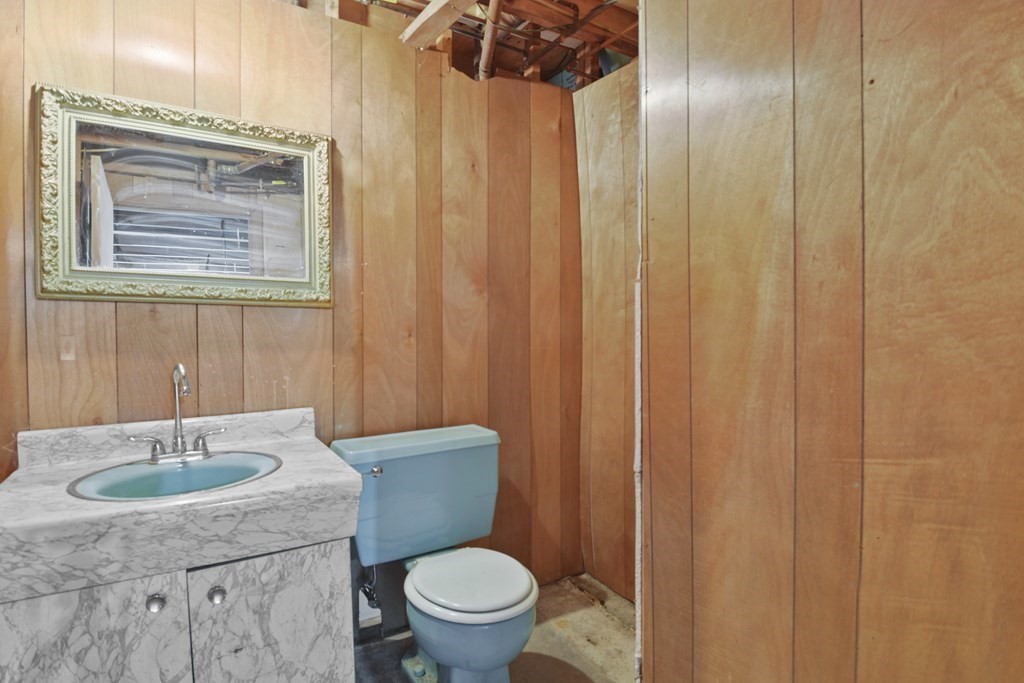 45 Bay Path Road Charlton, MA 01507 - Photo 15 of 35 a bathroom with a sink a toilet a mirror and vanity
