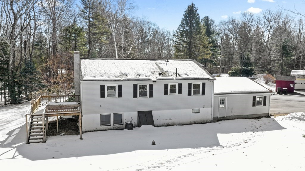 45 Bay Path Road Charlton, MA 01507 - Photo 21 of 35 a view of a house with a yard covered in snow