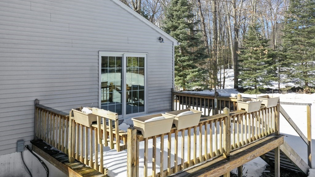 45 Bay Path Road Charlton, MA 01507 - Photo 25 of 35 a view of a deck with two chairs and wooden fence
