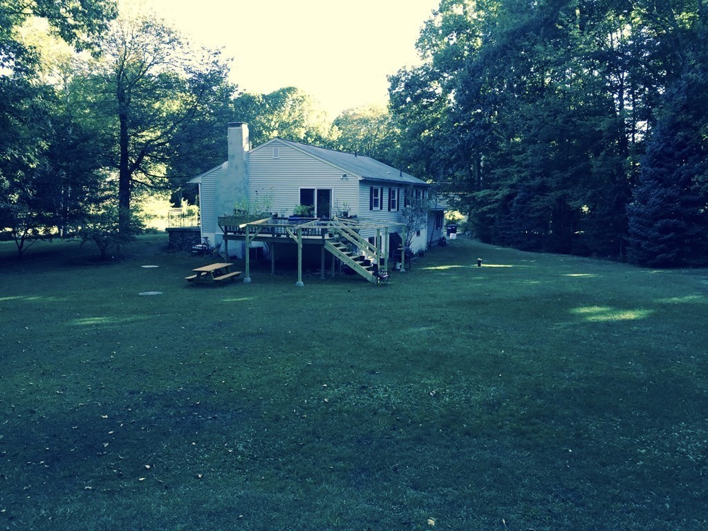 45 Bay Path Road Charlton, MA 01507 - Photo 31 of 35 a view of a house with backyard and sitting area