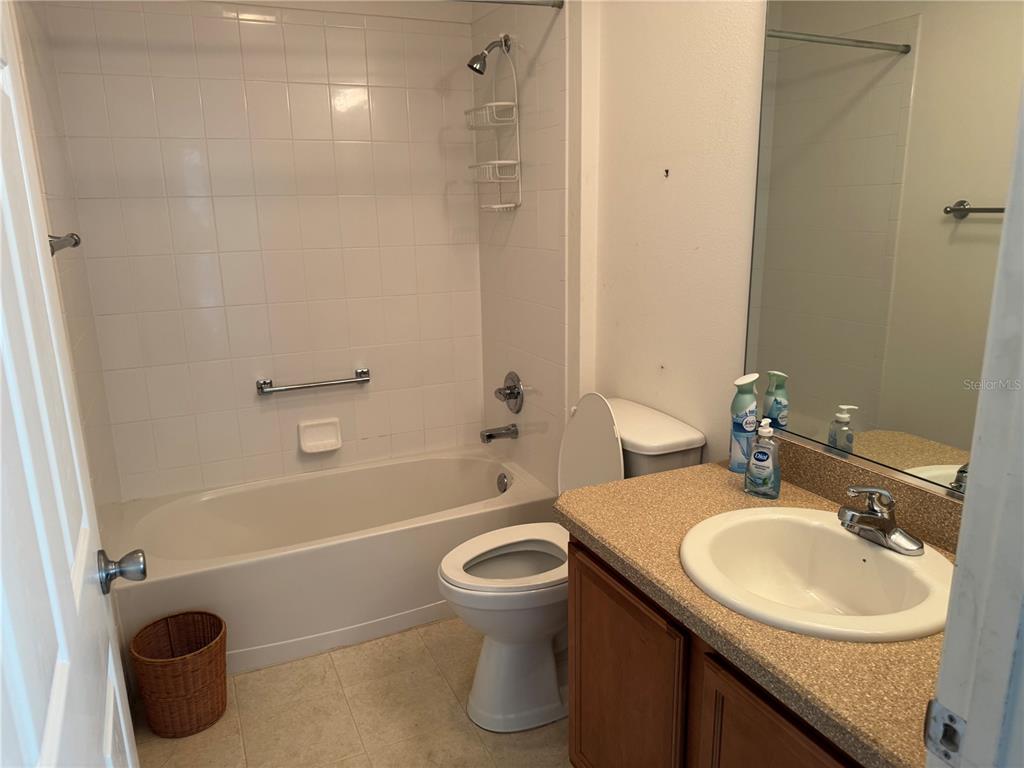 1083 Jackson Street The Villages, FL 32162 - Photo 13 of 15 a bathroom with a sink a toilet and shower