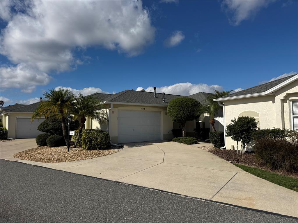 1083 Jackson Street The Villages, FL 32162 - Photo 3 of 15 a view of a house with a patio