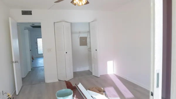 a bathroom with a glass shower door