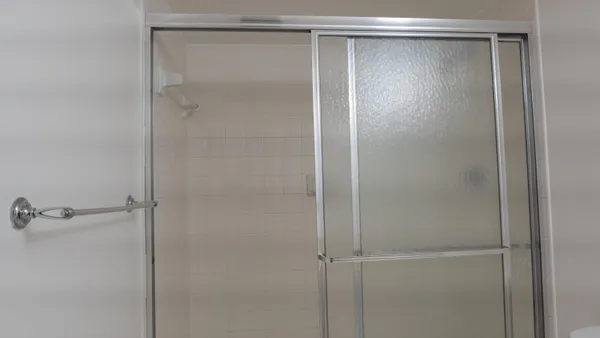 a bathroom with a bathtub and shower