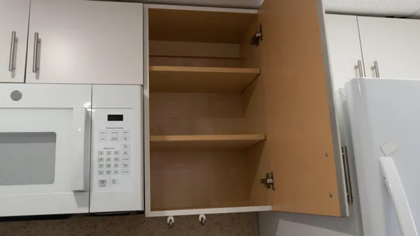 a view of a chandelier fan in a room