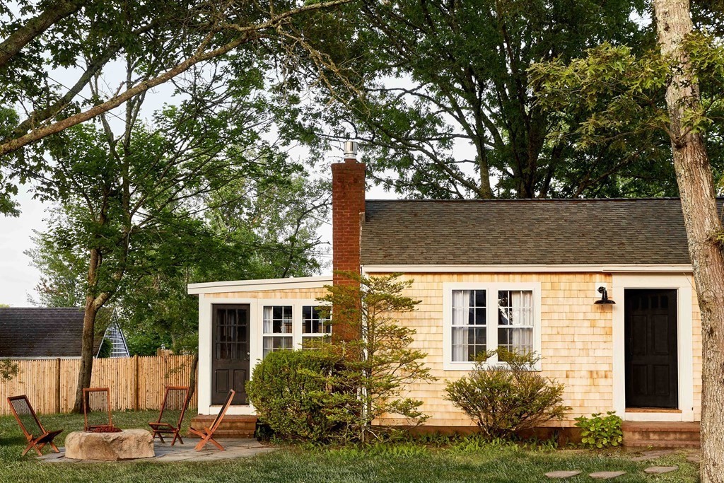 22 Manning Road Dennis Port, MA 02639 - Photo 9 of 10 a front view of a house with garden